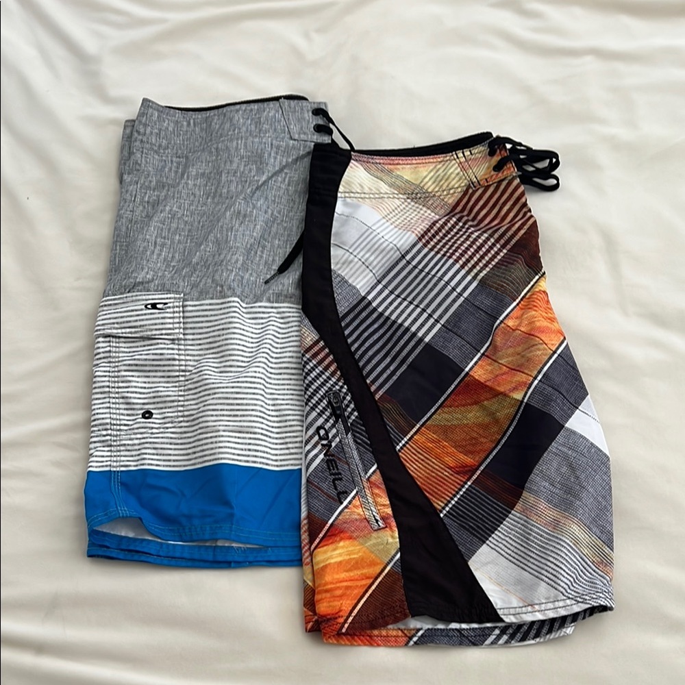 Two pairs EUC O'Neill Multicolor Striped Board Shorts Size 33